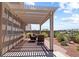 Shaded patio area with desert landscaping and beautiful views of the neighborhood at 3088 Evening Mist Ave, Henderson, NV 89052