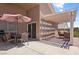 Outdoor patio with a covered area, dining table, and seating, ideal for al fresco dining at 3088 Evening Mist Ave, Henderson, NV 89052