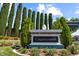 A 'Capistrano' community sign surrounded by mature landscaping creates a welcoming entrance at 3088 Evening Mist Ave, Henderson, NV 89052