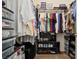Organized walk-in closet featuring rods, shelves, and storage bins for optimal organization and storage solutions at 3088 Evening Mist Ave, Henderson, NV 89052