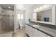 Bright bathroom featuring a walk-in shower and a white vanity with a gray countertop at 3108 Sonia Dr, Las Vegas, NV 89107