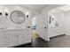 Bright, renovated bathroom with marble countertop vanity and modern black fixtures at 3108 Sonia Dr, Las Vegas, NV 89107