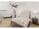 Bright bedroom featuring a mirror closet door, natural wood flooring, and a large bed at 3108 Sonia Dr, Las Vegas, NV 89107