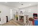 Bright room with a white table, decorated with a handmade stand and colorful objects at 3108 Sonia Dr, Las Vegas, NV 89107