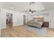 Primary bedroom features a king-sized bed, built-in shelving, and wood floors at 3108 Sonia Dr, Las Vegas, NV 89107