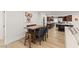 View of the dining room featuring a wooden table, six chairs, and hardwood floors throughout at 3108 Sonia Dr, Las Vegas, NV 89107