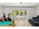 Bright exercise area offers plenty of natural light and view of the outdoor pool at 3108 Sonia Dr, Las Vegas, NV 89107
