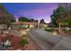 Stunning exterior view of a single-story home with a circular driveway and vibrant, low-maintenance landscaping at 3108 Sonia Dr, Las Vegas, NV 89107