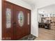 Elegant entryway featuring a decorative wood door and leading into a bright and open home office space at 3108 Sonia Dr, Las Vegas, NV 89107