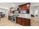 Modern kitchen featuring stainless steel appliances, dark wood cabinetry and plenty of counter space at 3108 Sonia Dr, Las Vegas, NV 89107