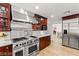 Well-equipped kitchen with stainless steel appliances and dark wood cabinetry at 3108 Sonia Dr, Las Vegas, NV 89107