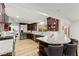 Open kitchen with granite countertops, dark wood cabinets, and stainless steel appliances at 3108 Sonia Dr, Las Vegas, NV 89107