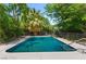 Refreshing pool surrounded by mature trees, providing a private and tranquil oasis for relaxation and recreation at 3108 Sonia Dr, Las Vegas, NV 89107
