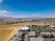 Expansive aerial view showcases a vibrant community and desert landscape against a clear blue sky and distant mountains at 3219 Timorasso Ave, Henderson, NV 89044