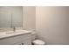 Simple bathroom features a modern vanity, white quartz countertop, and sleek fixtures at 3219 Timorasso Ave, Henderson, NV 89044