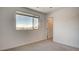 Bright bedroom with a large window and neutral colors, creating a calming and inviting atmosphere at 3219 Timorasso Ave, Henderson, NV 89044