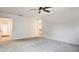 Spacious carpeted bedroom boasts a ceiling fan and easy access to a walk-in closet at 3219 Timorasso Ave, Henderson, NV 89044