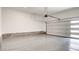 Spacious epoxy garage with an automatic door, providing secure parking and extra storage at 3219 Timorasso Ave, Henderson, NV 89044