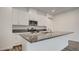 Stylish kitchen features white cabinets, stainless steel appliances, and granite countertops at 3219 Timorasso Ave, Henderson, NV 89044