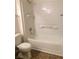 Bathroom featuring tile floors, a toilet, and a shower-tub combination with a white tile surround at 3318 N Decatur Blvd # 2077, Las Vegas, NV 89130
