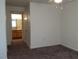 Bedroom featuring neutral walls, carpet flooring, and access to an ensuite bathroom at 3318 N Decatur Blvd # 2077, Las Vegas, NV 89130