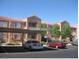 View of apartment complex featuring covered parking and landscaped grounds at 3318 N Decatur Blvd # 2077, Las Vegas, NV 89130