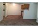 Living room features access to the kitchen with appliances, and laundry closet at 3318 N Decatur Blvd # 2077, Las Vegas, NV 89130