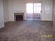 Living room featuring a fireplace and sliding glass door to the balcony at 3318 N Decatur Blvd # 2077, Las Vegas, NV 89130