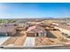 Aerial view of a charming single-story home with a 2 car garage nestled in a well-planned community at 3665 E Garfield Dr, Pahrump, NV 89061
