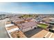 High aerial view of a house with artificial turf in a single Gathering home near desert mountains at 3665 E Garfield Dr, Pahrump, NV 89061
