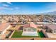 High aerial view of a house with artificial turf in a single Gathering home in a Primary-planned community at 3665 E Garfield Dr, Pahrump, NV 89061