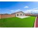 This backyard has a concrete patio and artificial grass at 3665 E Garfield Dr, Pahrump, NV 89061
