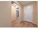 Welcoming entryway featuring wood-look tile flooring and a bright white front door at 3665 E Garfield Dr, Pahrump, NV 89061