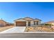 Charming single story home with a two car garage and low maintenance desert landscaping at 3665 E Garfield Dr, Pahrump, NV 89061