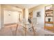 A staged home office with glass desk, comfortable chair, and ample storage at 3665 E Garfield Dr, Pahrump, NV 89061