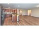 Bright kitchen with stainless steel appliances, granite countertops, island, and hardwood floors throughout at 3665 E Garfield Dr, Pahrump, NV 89061