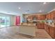 Open concept kitchen with hardwood floors, granite countertops, stainless steel appliances, and ample cabinet space at 3665 E Garfield Dr, Pahrump, NV 89061