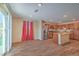 Open concept living and dining area boasts stainless steel appliances, granite countertops, and wood floors at 3665 E Garfield Dr, Pahrump, NV 89061