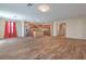 Open living room with hardwood floors featuring stainless steel appliances, granite countertops, and center island at 3665 E Garfield Dr, Pahrump, NV 89061