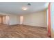 Spacious living room boasts wood-look tile flooring, neutral walls and abundant natural light at 3665 E Garfield Dr, Pahrump, NV 89061