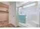 Bright shower features glass door, white tile and a window at 3665 E Garfield Dr, Pahrump, NV 89061