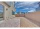 Low-maintenance backyard with a brick patio and rock landscaping, enclosed for privacy and relaxation at 4333 Tabor Peak Ave, Las Vegas, NV 89141