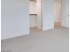 Bedroom featuring neutral carpet, white walls, a doorway, and a closet with a rod at 4333 Tabor Peak Ave, Las Vegas, NV 89141