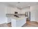Modern kitchen featuring white cabinets, stainless steel appliances, and a center island at 4333 Tabor Peak Ave, Las Vegas, NV 89141