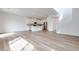 Bright, open living space with wood floors, a modern kitchen, and a staircase at 4333 Tabor Peak Ave, Las Vegas, NV 89141