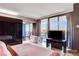 Bright bedroom with city views, a soaking tub, and modern furniture at 4381 W Flamingo Rd # 3002, Las Vegas, NV 89103