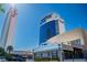 Exterior shot of The Palms towers and restaurant with street view and lush landscaping at 4381 W Flamingo Rd # 3002, Las Vegas, NV 89103