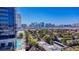 Exterior showcases city skyline views, pool, green landscaping, and contemporary building architecture at 4381 W Flamingo Rd # 3002, Las Vegas, NV 89103