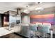 Modern kitchen boasts stainless steel appliances, sleek countertops, and stylish pendant lighting at 4381 W Flamingo Rd # 3002, Las Vegas, NV 89103