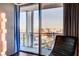 Cozy chair placed near a large window offering city views at 4381 W Flamingo Rd # 3002, Las Vegas, NV 89103